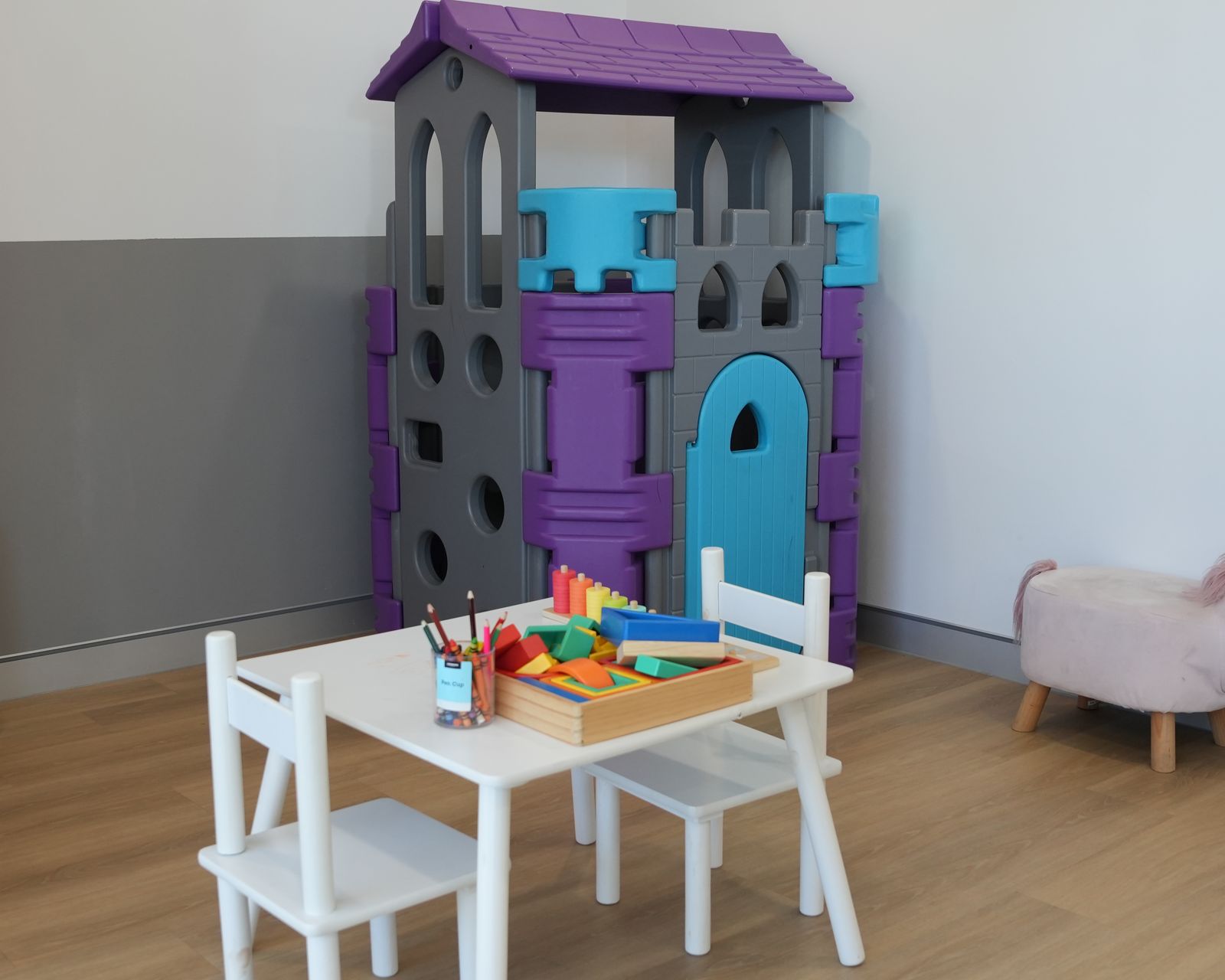 The children's play area at Gosford Doctors, West Gosford, with a play castle and activity table