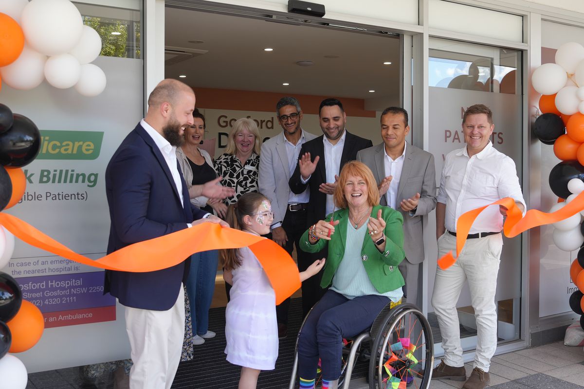 Cutting the ribbon at the entrance to Gosford Doctors in West Gosford