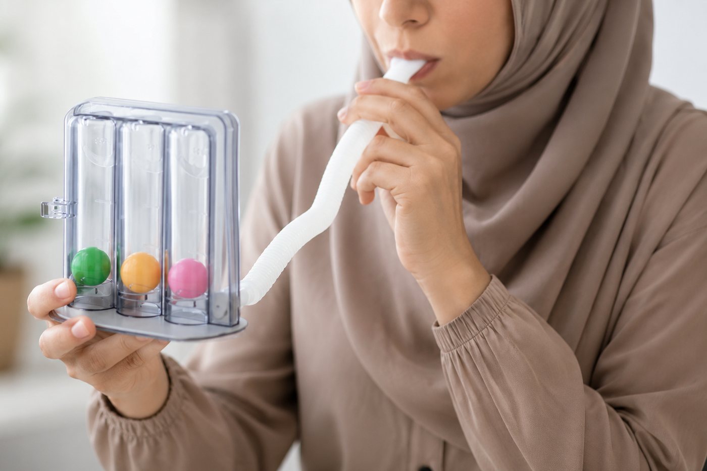 Spirometry: a person breathing into a lung function device